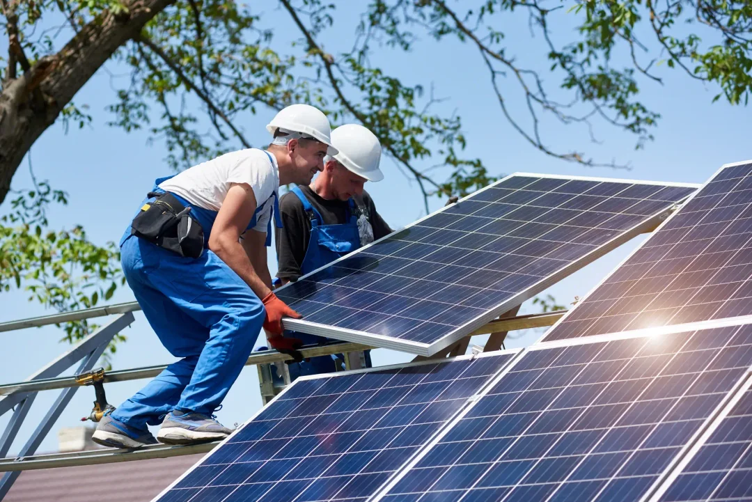 Two technicians providing solar energy system